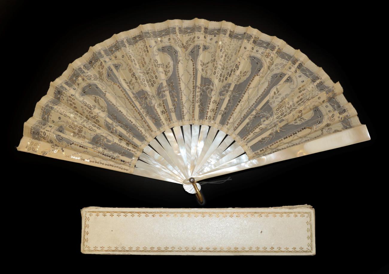 An Elegant Circa 1900 Sequin Fan, the monture of white Mother of Pearl, with bone ribs.