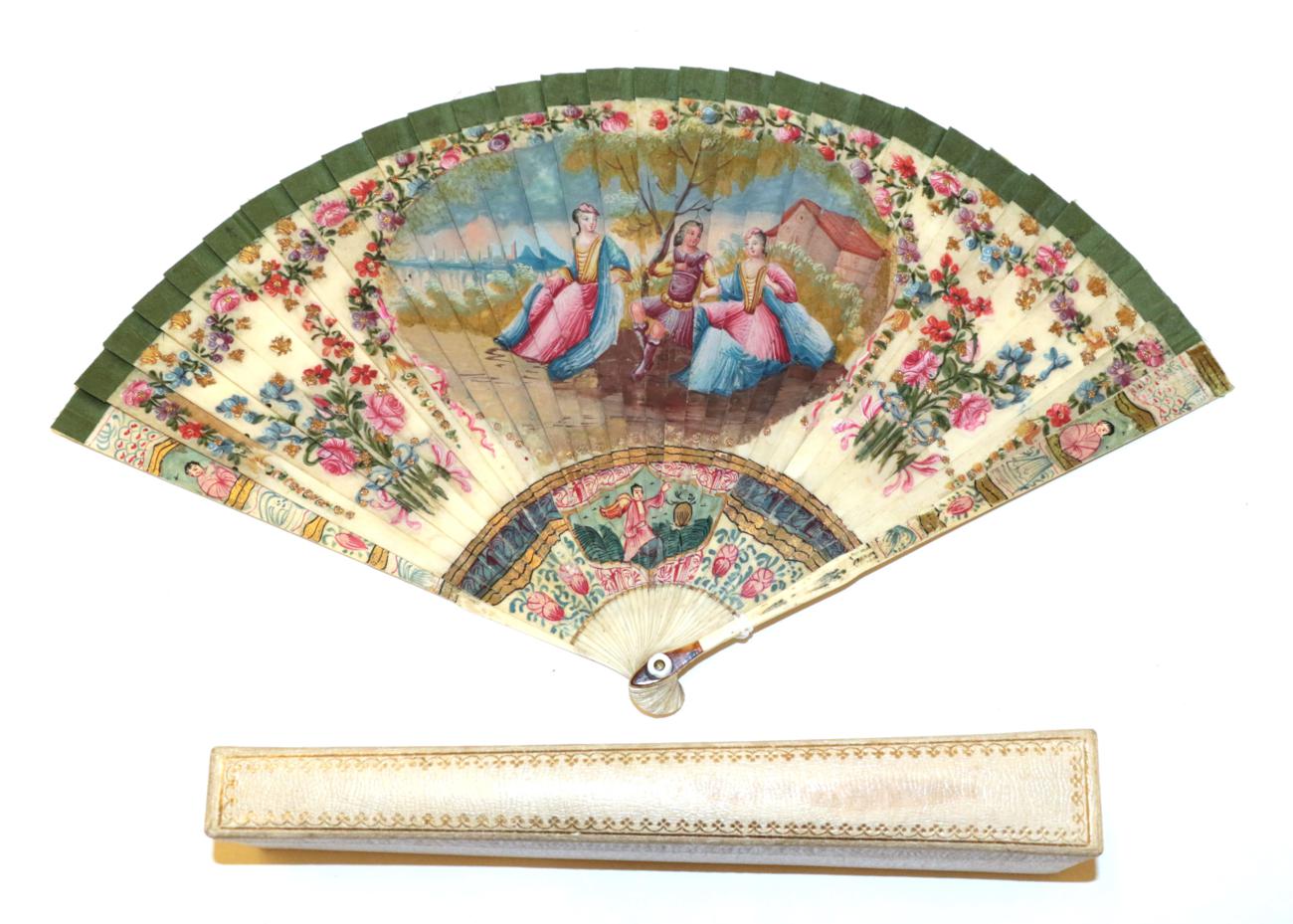 An 18th Century Ivory Brisé Fan, ribboned in green silk,