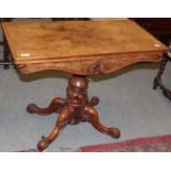 A 19th century burr walnut fold-over card table, raised on a lotus carved standard and down swept