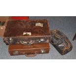 Two leather suitcases and a Gladstone bag