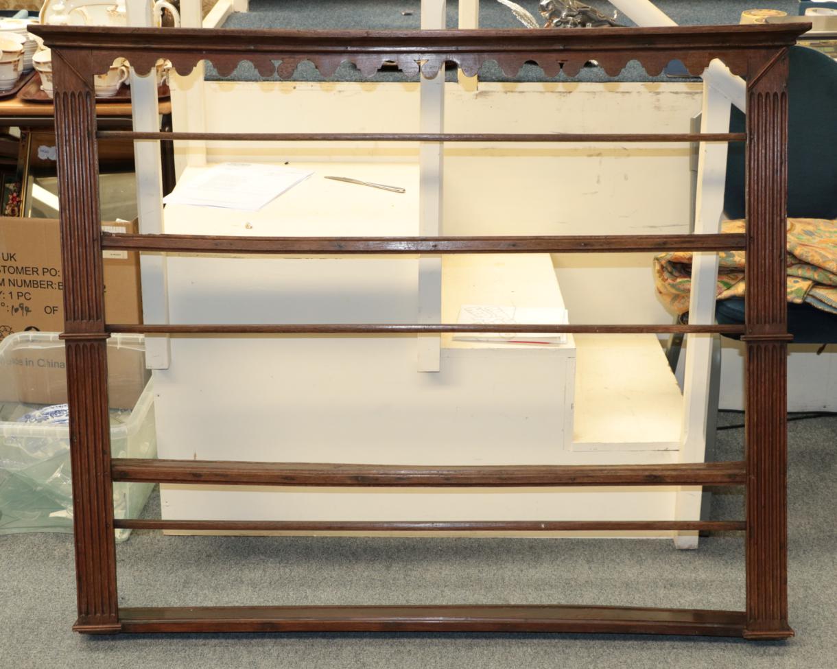 An 18th century oak plate rack with three shelves, 126cm wide