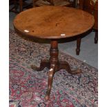 A George III oak tilt-top tripod table