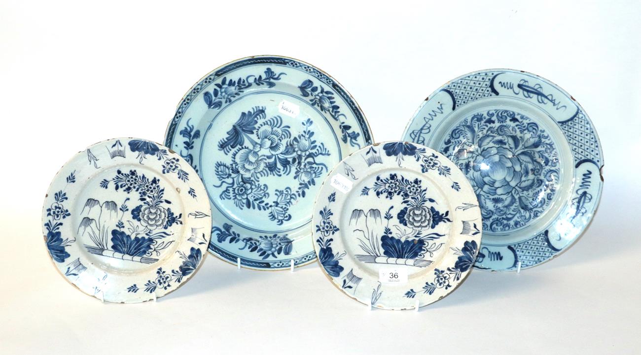 Two 19th century blue and white English Delft plates; together with a smaller pair of English Delft