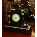 A late Victorian black slate and marble mantel timepiece