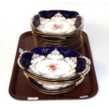 A Coalport blue ground part dinner service decorated with painted flowers,