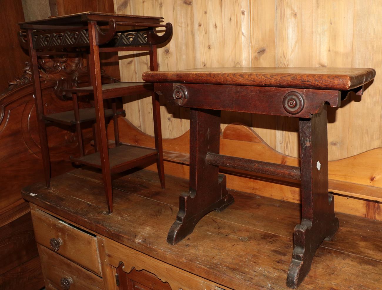 A mahogany side table in the Orientalist taste (20th century) and an oak Gothic style stool (2)