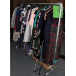 Rail of mainly modern clothing, including dresses, separates, coats etc, two boxes of assorted hats,