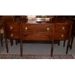 A Georgian style mahogany breakfront sideboard, raised on fluted and turned cylindrical legs, 6ft