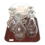 A pair of triple ring neck decanters; two similar decanters;