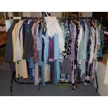 Rail of mainly modern clothing, including dresses, separates, coats etc,