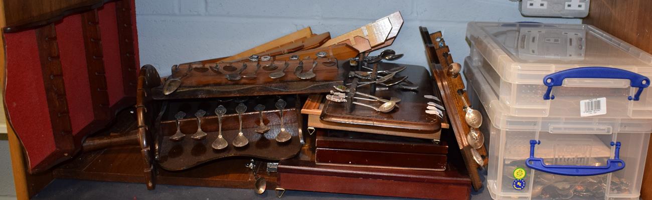 A group of collector spoons and racks