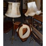 A brass rope twist standard lamp and silk shade;