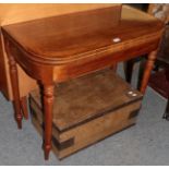 A 19th century cross banded and inlaid mahogany fold-over tea table;