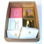 Four assorted Estée Lauder solid perfume compacts,