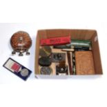 A box of collectables including various gold nib pens, bronzed desk stand, carved case,