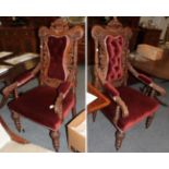 A pair of Victorian carved oak open armchairs