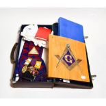 A leather case, containing Masonic regalia,
