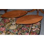 A pair of walnut oval leaf design side tables, on metal form legs,