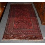 A Bukhara style rug, the central field of lozenges on a red brick ground, among narrow borders,