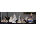 A group of 20th century ceramics including: Nao nativity figures; Nao brides; Coalport ladies;