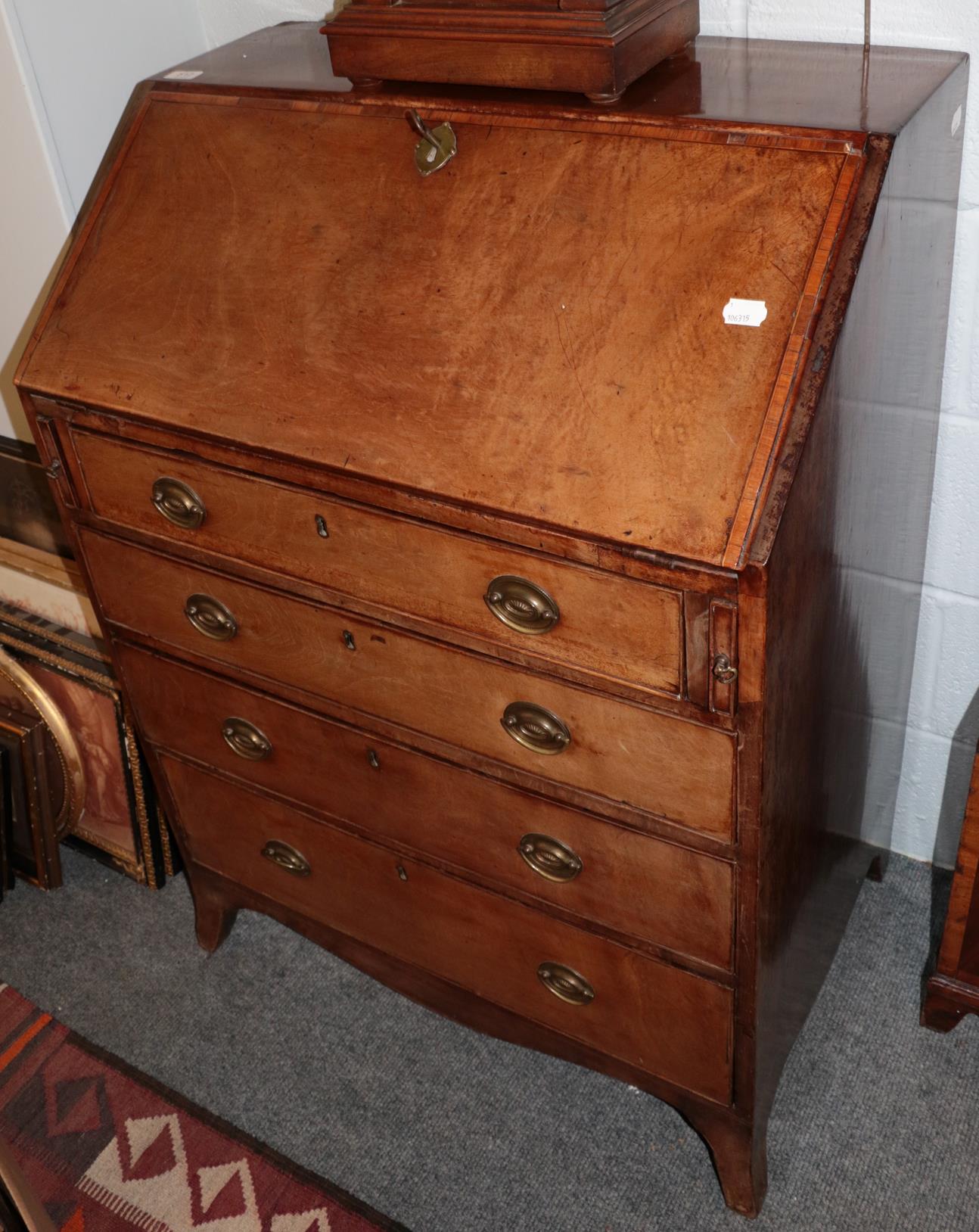 A 19th century crossbanded mahogany bureau (a.f.)