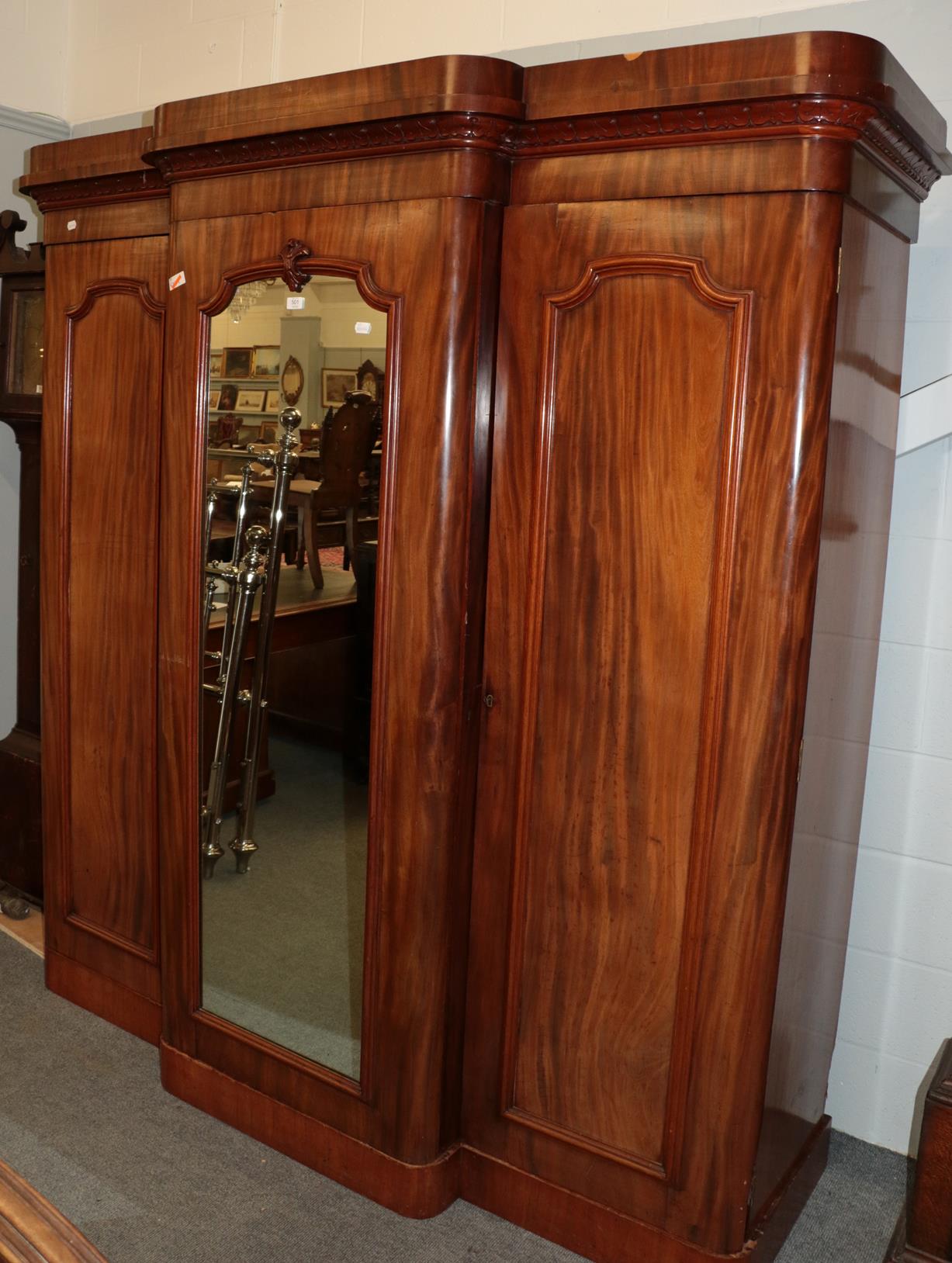 ^ A substantial Victorian breakfront mirrored triple door wardrobe with fully fitted and lined