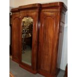 ^ A substantial Victorian breakfront mirrored triple door wardrobe with fully fitted and lined