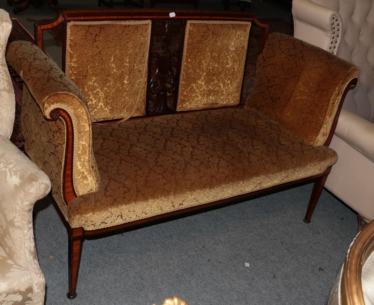 An Edwardian inlaid mahogany sofa