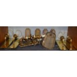 ^ A set of four gilt metal scroll cast single wall lights with brass back plates and marble glass