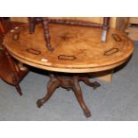 An inlaid burr walnut oval tilt-top occasional table, the top on five turned supports, raised on