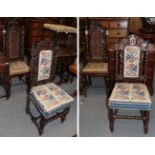 A pair of 17th century style carved and turned oak hall chairs with wicker backs and needlework