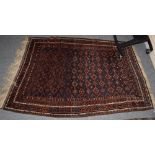 An Indo-Persian rug, the central field of lozenges surrounded by narrow geometric borders,