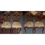 A set of four mahogany balloon back chairs