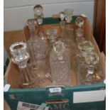 A group of eleven decanters comprising four pressed glass square form examples,