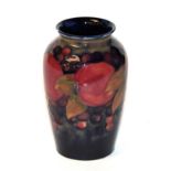 A William Moorcroft Pomegranate pattern vase, on a blue ground,