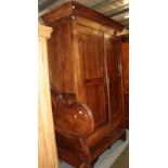 An 18th century French armoire with cupboard doors enclosing hanging space and a deep drawer to