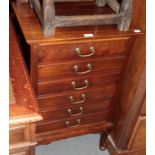 An Edwardian mahogany six-drawer music cabinet