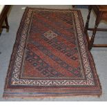 A Kurdish rug, the central field of crowded hook geometric shapes, within narrow borders,