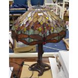 A large Tiffany style table lamp with shade decorated with dragon flies