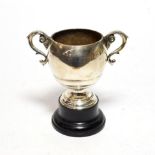 A silver twin handled pedestal cup