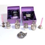 A quantity of children's silver, comprising: three pairs of tooth boxes, one modelled as a toy