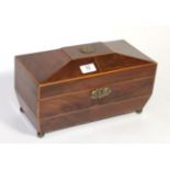 An early 19th century Sarcophagus shaped satinwood banded mahogany tea caddy, the interior with twin