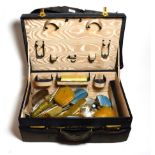 A nine-piece silver and enamel dressing table set (a.f.) other silver backed dressing table items