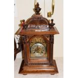 A late 19th century walnut striking mantel clock, movement stamped Junghans