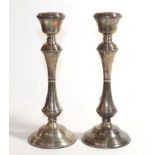 A pair of Elizabeth II silver candlesticks, by Broadway and Co., Birmingham, 1978, each on