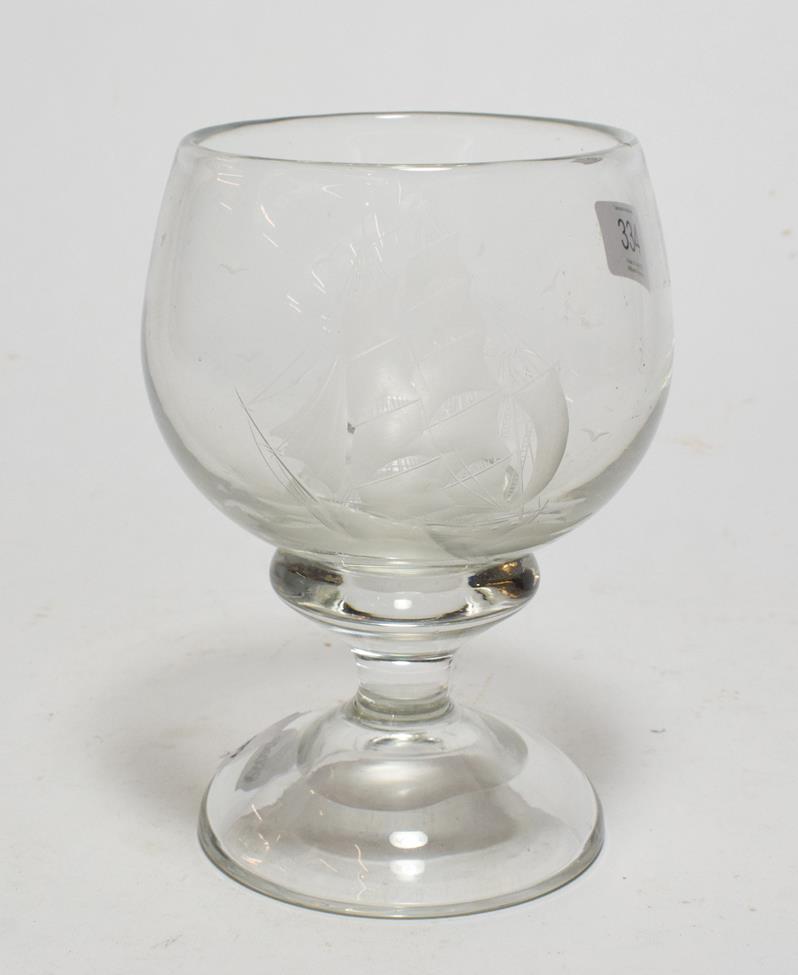 A 19th century etched glass pedestal cup, decorated with a triple masted ship amongst the waves