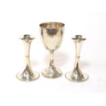 A pair of George V silver candlesticks, Birmingham, 1916, trumpet-shaped, filled, 15.5cm high,