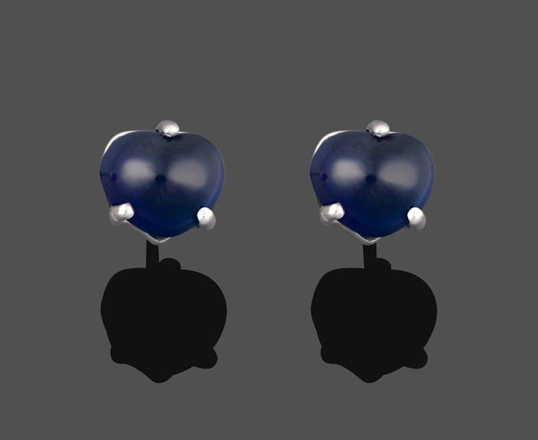 A Pair of Sapphire Earrings, the heart shaped cabochon sapphires in a white three claw setting, with