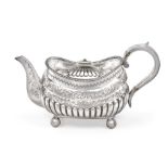A Victorian Silver Teapot, by Richard Martin and Ebenezer Hall, London, 1879, oblong and on four