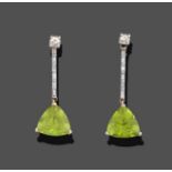 A Pair of Peridot and Diamond Drop Earrings, a round brilliant cut diamond suspends a fixed bar
